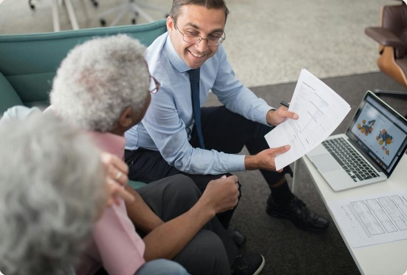 An advisor meeting an older couple at home