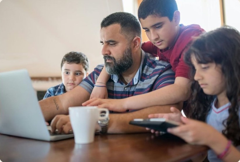 A family building a plan around the kitchen table